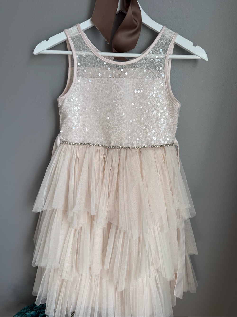 Girls sequin tiered tulle dress with ribbon sash.